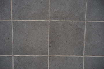 grey tile siding on building
