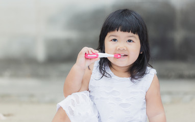 Adorable girl practice or learning for brush teeth for healthy.