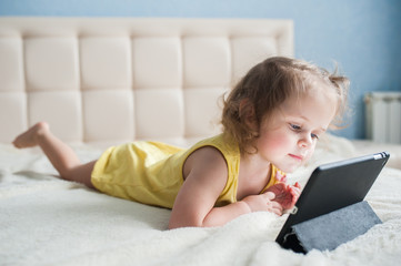 Happy child with tablet computer.