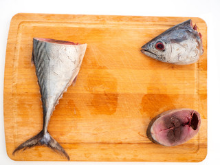 mackerel fish on wooden background.