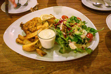salmon deep fried with potato fried and salad