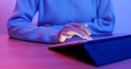 Woman touch on the screen of tablet