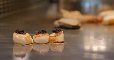 Cooking Teppanyaki in restaurant with scallop