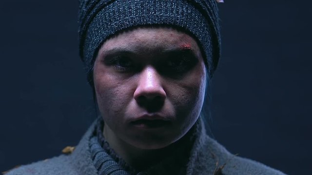 Portrait of homeless woman facing challenges, belief in better life, closeup