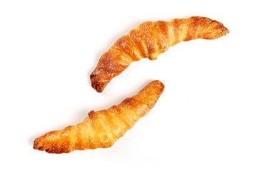 Two croissants on a white background, shot from the top, with a place for text