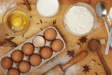 Food ingredients for baking: flour, eggs, milk, sugar	