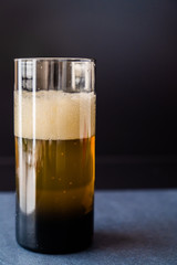 Glass of Refreshing beer on Black Background