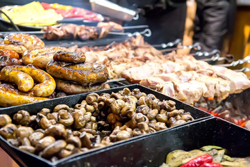 Grilled mushrooms on outdoor market stall. Selective focus