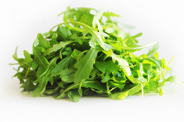 Obraz premium Fresh arugula leaves rucola on white background