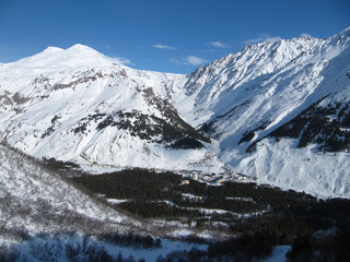 Panorama from height of flight of the aircraft in the valley of mount Elbrus and mount Elbrus in the North Caucasus of Russia in the winter.