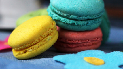 Colored macaroons on a light blue background.