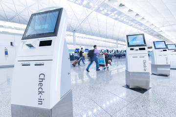 Self service machine and help desk kiosk at airport for check in, printing boarding pass or buying ticket - obrazy, fototapety, plakaty