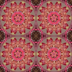 Seamless pattern in indian style with flower mandala and paisley in warm tones.