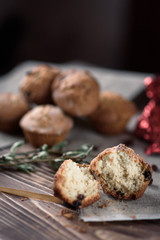 Homemade baking: Cupcakes with raisins sweets on linen cloth on a wooden background. 