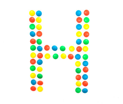 Multicolored alphabet from children's mosaic letter H