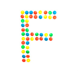 Multicolored alphabet from children's mosaic letter F