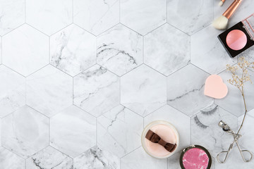 make up cosmetic flat lay top view on the tile marble white color look clean with copy space for text