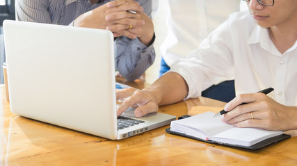 Obraz premium Business Team Meeting Using Laptop Discussion together while going through paperwork Connection Concept at office.