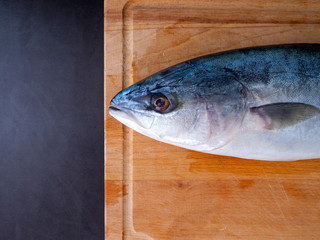 Raw Mackerel on a kitchen cutting board