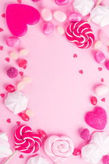 Candies, lollipops, jelly on pink