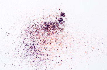 crushed purple and pink eye shadow on white background 