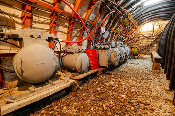 Mine tunnel with equipment. Control station in the mine tunnel. Selective focus