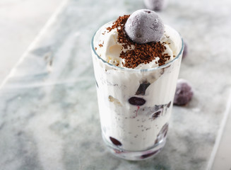 Ice cream with cherry berries on  marble countertop background