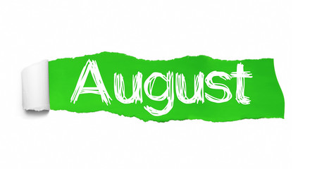 The word August appearing behind green torn paper