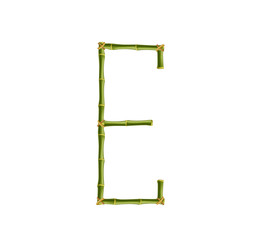 Capital letter E made of green bamboo poles on white background.
