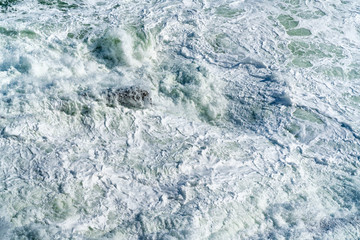 The frothy ocean water