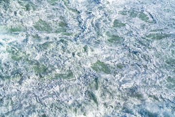 The frothy ocean water