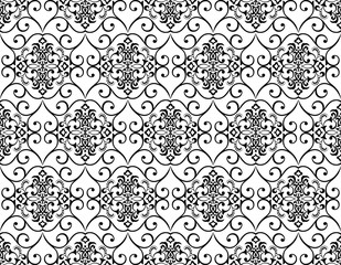 Floral pattern. Vintage wallpaper in the Baroque style. Seamless vector background. White and black ornament for fabric, wallpaper, packaging. Ornate Damask flower ornament