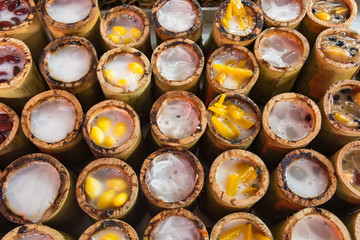 Khao Lam, Sticky rice soaked in coconut milk and baked in a section of bamboo stem, Thai dessert.