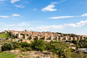 Fototapeta na wymiar Panoramic view of the historic city of Avila from the Mirador of Cuatro Postes, Spain, with its famous medieval town walls. UNESCO World Heritage. Called the Town of Stones and Saints
