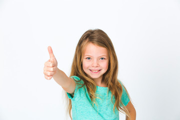 portrait of young, pretty girl with blond hair in the studio