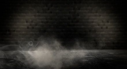 Background of an empty dark-black room. Empty brick walls, lights, smoke, glow, rays 