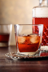Glass of scotch whiskey and natural ice .