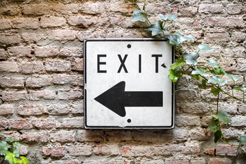 Exit direction sign pointing to the left