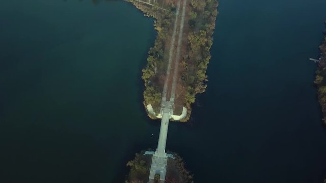 Aerial footage over Echo Park Lake, Kishinev, Moldova republic of. View of lake and smille bridge.