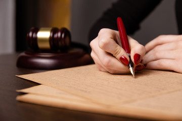 Notary public in office signing document