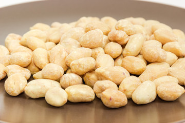 Roasted salted peanuts close-up at selective focus