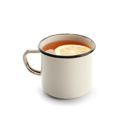 Mug of hot tea with lemon  on white background
