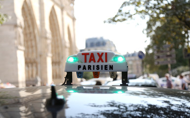 French taxi with access lights in the capital of France