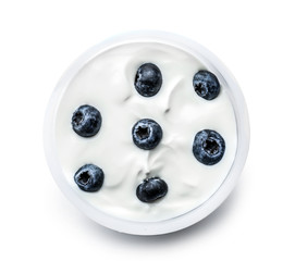 Plastic cup of tasty yogurt with blueberry on white background