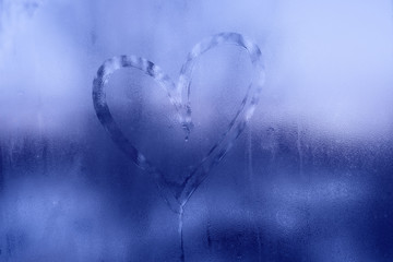 Frozen heart in window. Valentines day concept.