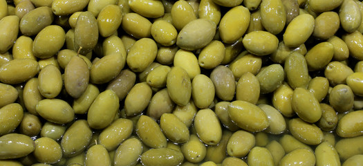 green pickled olives for sale in the Italian food stand