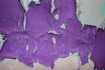 Shabby old paint on the wall purple