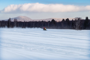 Athlete on a snowmobile.