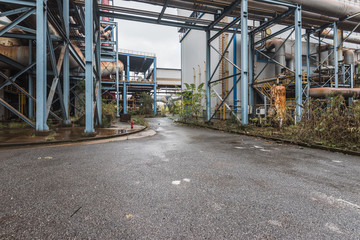 Fototapeta na wymiar Industrial buildings in abandoned industrial site