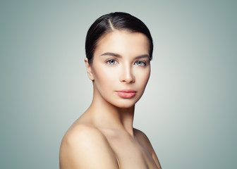 Healthy woman brunette with clear skin. Facial treatment, skincare and spa concept